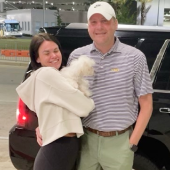 Mawoo father and daughter holding new puppy